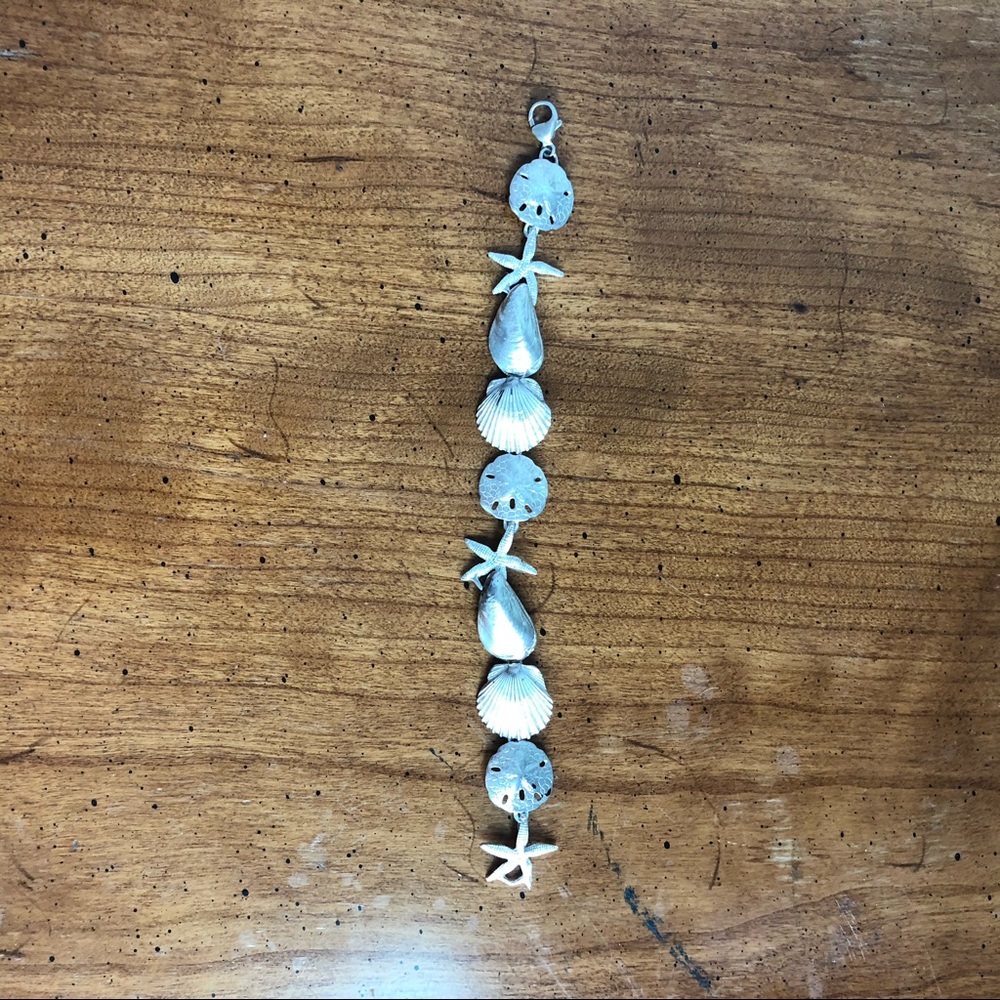 Silver ocean inspired link bracelet.